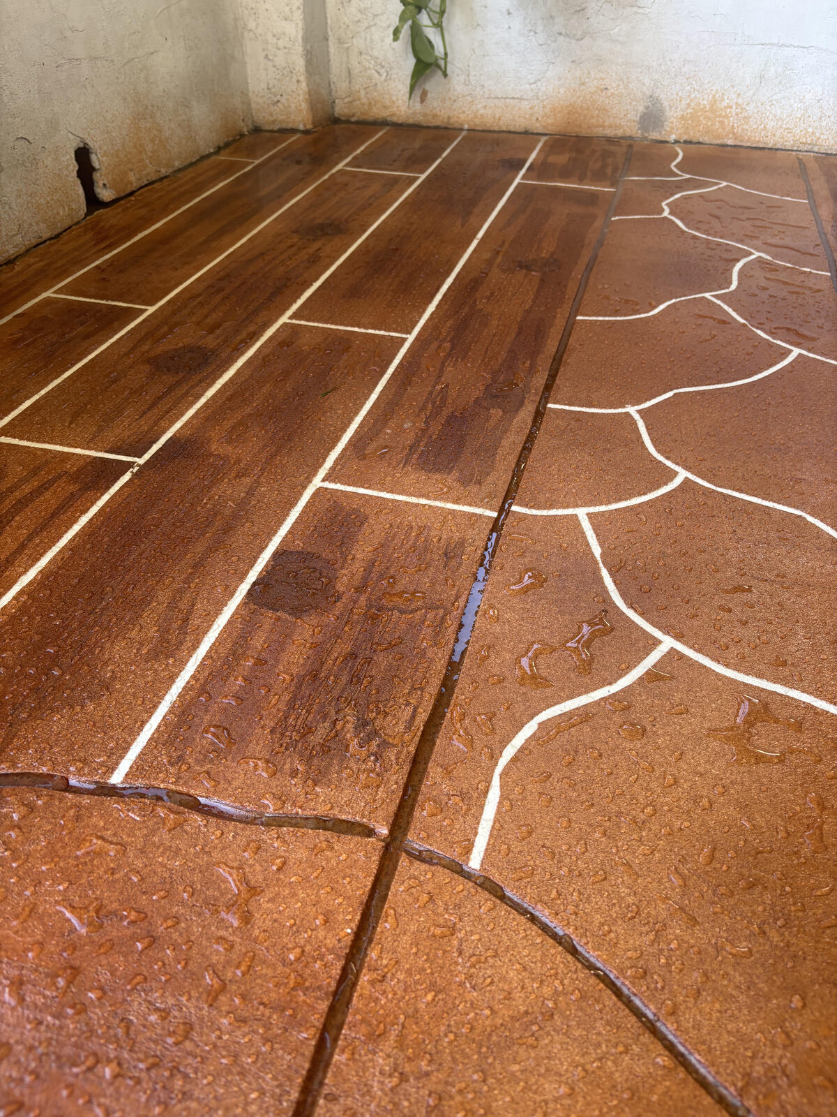 Decorative stained concrete with wood-plank and flagstone patterns on a Hamilton, OH project