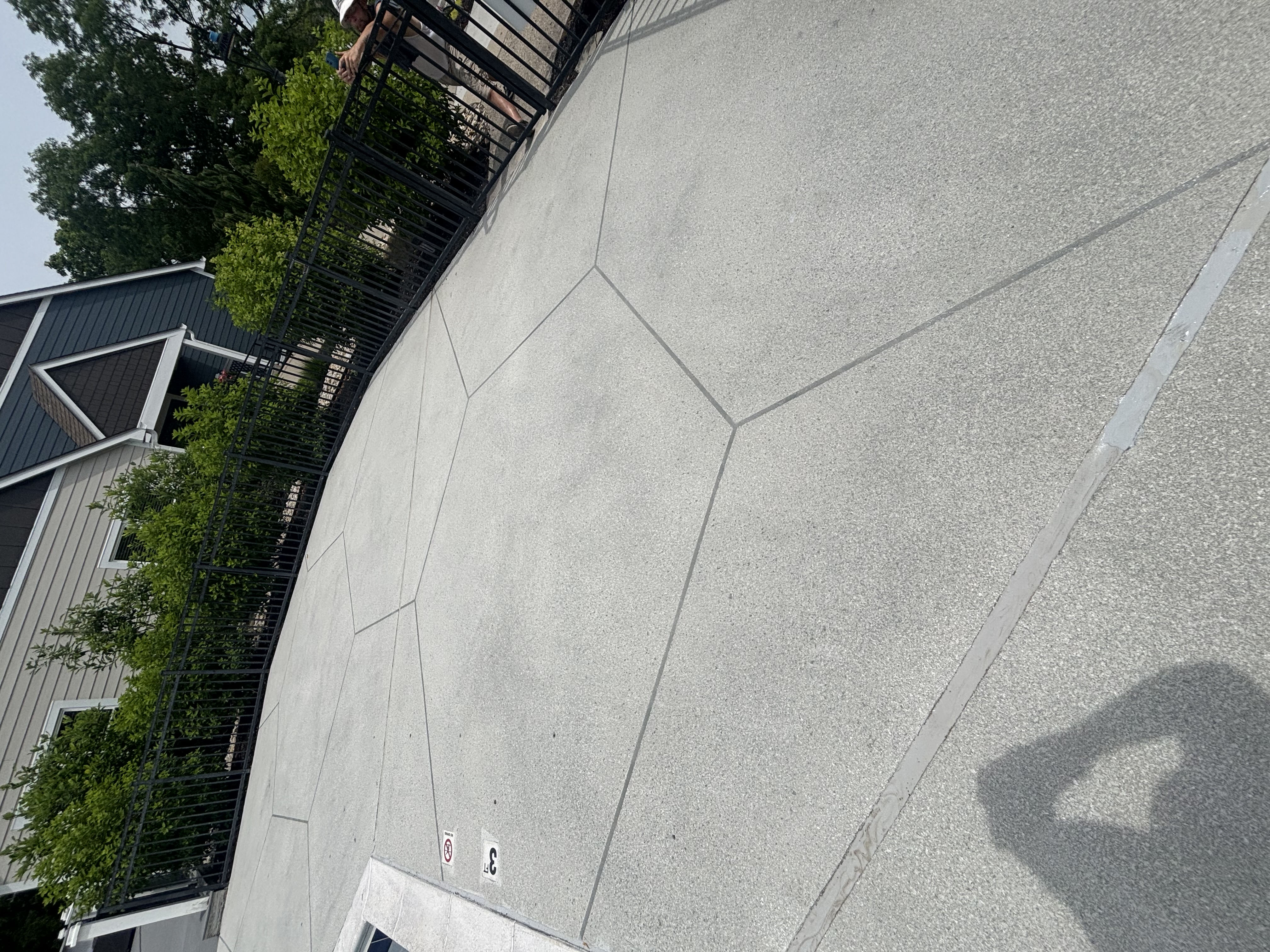 Pool deck resurfacing project with geometric concrete overlay in Maineville, OH